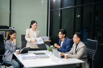 Group of Asian business meeting in planning design in creative business discussing work