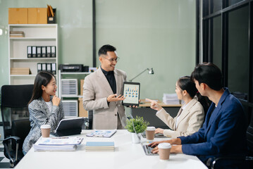 Business teamwork and collaboration among Asian professionals in a modern office