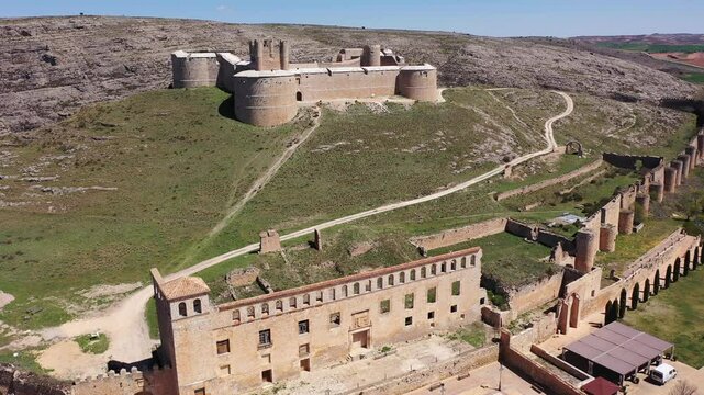 Berlanga de Duero medieval castle ruin near Soria, in the Castilla Leon region Spain with blue sky from the air