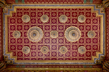 BANGKOK, THAILAND - April 14, 2025 : Golden Thai Ornament Background on Colorful Thai Temple wall at Thai Buddhist Temple, Thailand.