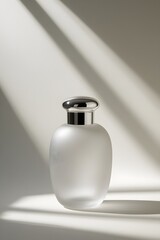 Obraz premium Elegant Frosted Glass Perfume Bottle with Silver Cap Minimalist Product Photography