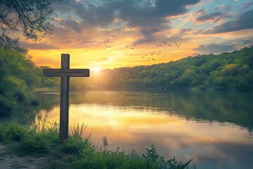 Wooden cross by lake at sunset