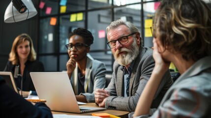 A business team and manager having a meeting together.


