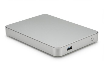 A close up shot of a silver external hard drive on a white surface with a usb port visible