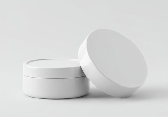 Two white cosmetic containers displayed against a plain white background in a studio setting