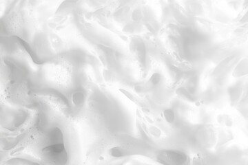Soft, delicate, white foam texture.  Close-up view of a frothy, airy substance