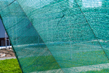 Sunshade net, green color. Protection from heat and scorching sun