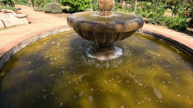 footage of a water fountain with lush green trees and plants and colorful flowers at Descanso Gardens La Canada Flintridge California USA