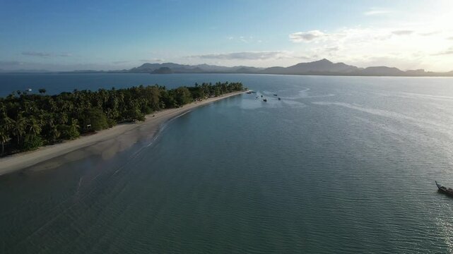 Aerial view of Andaman sea and long tail boat in Koh Mook, Thailand