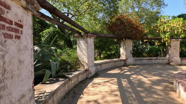 footage of a water fountain with lush green trees and plants and colorful flowers at Descanso Gardens La Canada Flintridge California USA