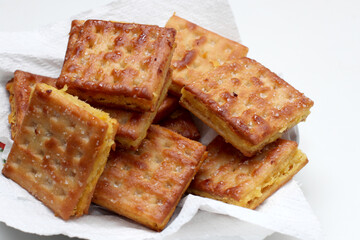 Gabin Tape, Indonesian traditional snack. Fried crackers filled with mash fermented cassava, isolated on white background
