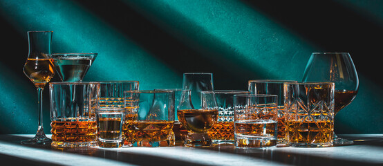 Strong hard alcoholic drinks, spirits, liqueurs, distillates, whiskey and others. Drink background...