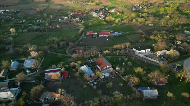 Peaceful rural landscape in the morning sunlight. Aerial drone overview of Zaicesti village, Romania
