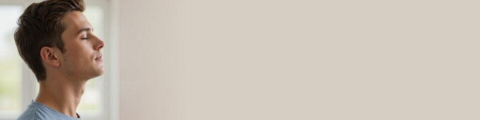 Obraz premium Calm young man enjoying solitude in a peaceful indoor setting 