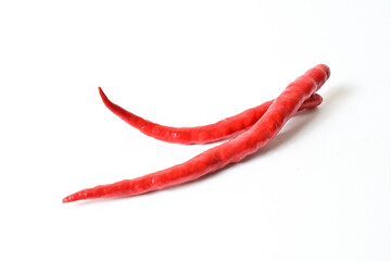 Close up view of two (2) fresh red chili peppers isolated on white background. Clipping path.