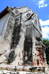 Closeup of The Part of an old abandoned temple with only bricks and cement remaining, which had been abandoned for a long time in the forest background at Thailand.