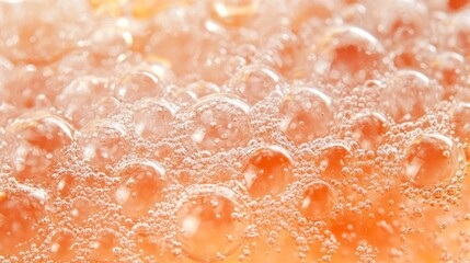 Fototapeta premium Close-up of Orange Bubbles and Foam Texture