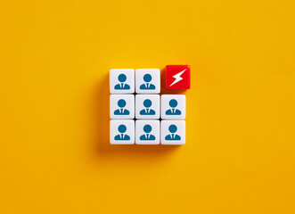 Lightning bolt replacing businessman in a corporate team: concept of innovation and new energy