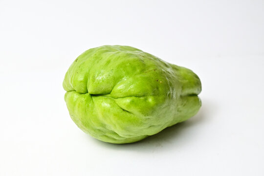 Close up view of chayote isolated on white background. Clipping path. Green. Fresh.