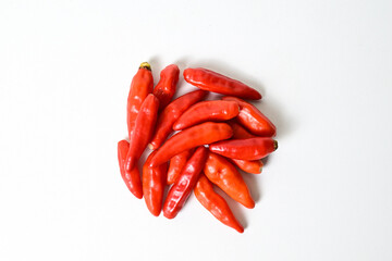 Top view of fresh red chili peppers isolated on white background. Clipping path. Pile, stack.  close up.