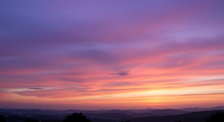 Fototapeta premium Serene Sunset Landscape: Pastel Hues over Rolling Hills