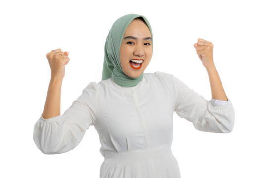 Excited young Asian woman in green hijab and white blouse gesturing yes with raised hand, celebrating victory, success isolated on transparent background