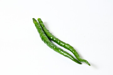 Close up view of two (2) fresh green chili peppers isolated on white background. Clipping path.
