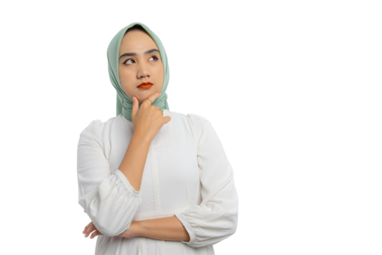 Pensive young Asian woman in green hijab and white blouse looking aside at empty space and touching chin, thinking, making decision, having doubts isolated on transparent background