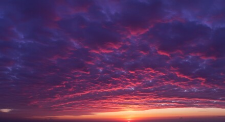 Crimson Sunset Cloudscape: A Dramatic and Vivid Evening Sky