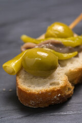 Traditional Spanish Gilda Pintxo Skewer with Olive, Anchovy and Pickled Pepper