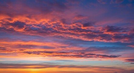Fototapeta premium Fiery Sunset Cloudscape: A Dramatic and Colorful Sky