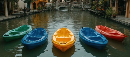 Colorful Kayaks on Canal with Buildings