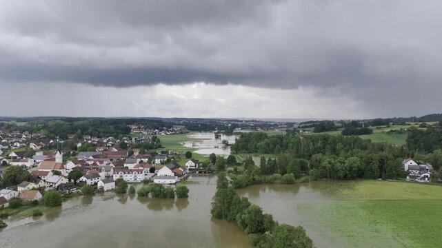 Fly towards Pfaffenhofen over flooded Ilm during high water 2024 in Germany, Bavaria.