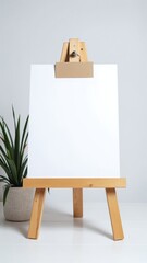 Paper Mockup on Easel with Extra Card, White Background, Light Wooden Finish