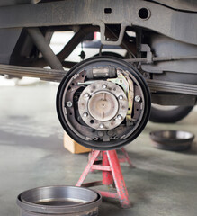 Pickup truck replace drum brake shoes of rear axle.