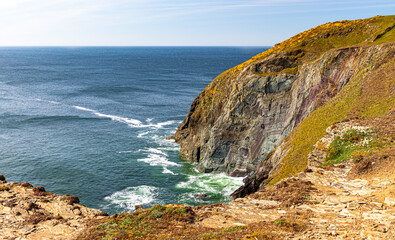 Landscape on a sunny April day. Beautiful view of the mountains and ocean. Padstow Cornwall, UK.