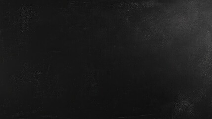 A textured black surface displays subtle variations and imperfections, ideal for artistic endeavors or as a versatile background for various creative projects