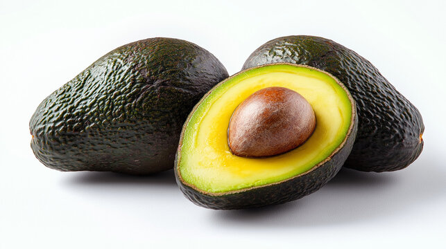Fresh avocados with one cut open to reveal the vibrant green interior and seed, placed on a clean white background. AI Generated Images - Powered by Adobe