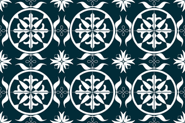 Seamless vintage ornamental tile pattern. White on dark teal, with delicate floral and circular details. Ideal for traditional decor, textiles.