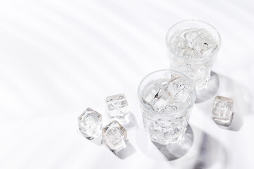 Crystal-clear glasses filled with chilled water and ice cubes