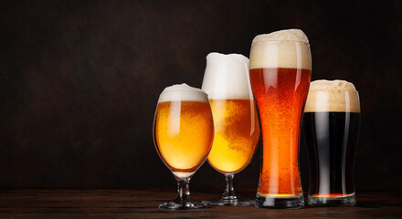 A selection of various beer glasses filled with different types of beer