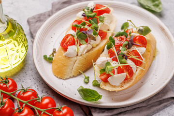 Delicious antipasto caprese toast topped with fresh mozzarella