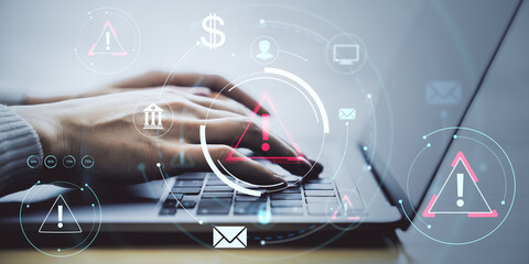 Person typing on laptop with cybersecurity warning icons and digital interface over light background, symbolizing online threat protection concept.