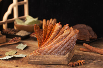 Pork crisps are placed on a wooden table