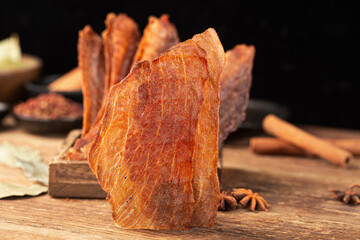 Pork crisps are placed on a wooden table