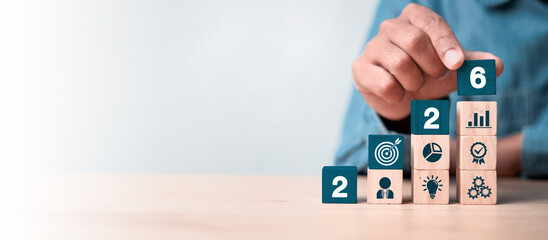 Businessman plan strategy marketing and finance to goal in 2026 planning business growth with...