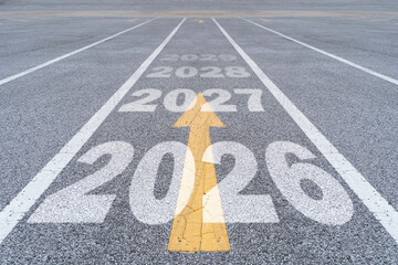 New year 2025 or straight forward concept. Text 2026, 2027, 2028, 2029 written on the road.