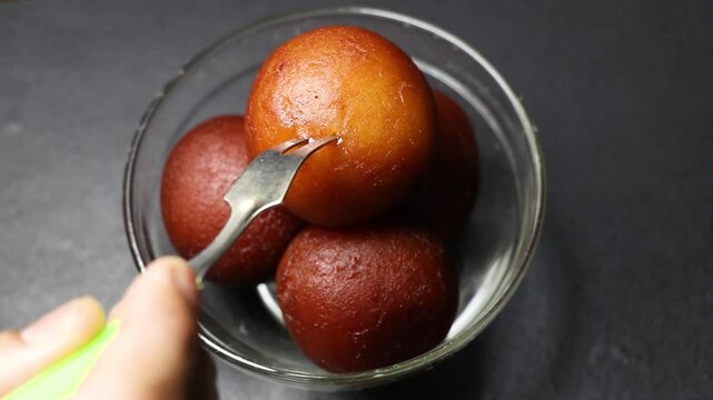 Gulab jamun is an Indian popular sweetmade with milk solids, sugar, rose water & cardamom powder