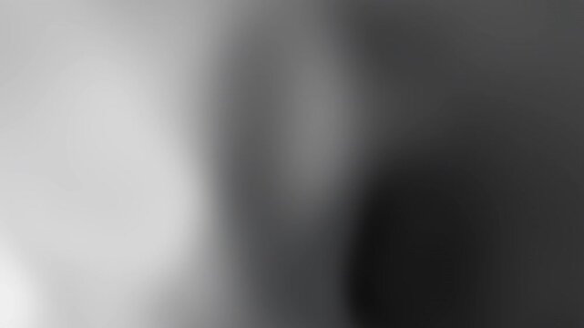 Simple black and white gradient background suitable for minimalistic designs, text overlays, and artistic projects needing a clean aesthetic.