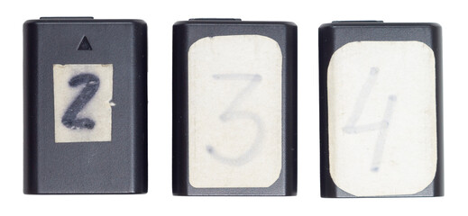 Isolated set of rechargeable batteries with numbers for digital camera on white background